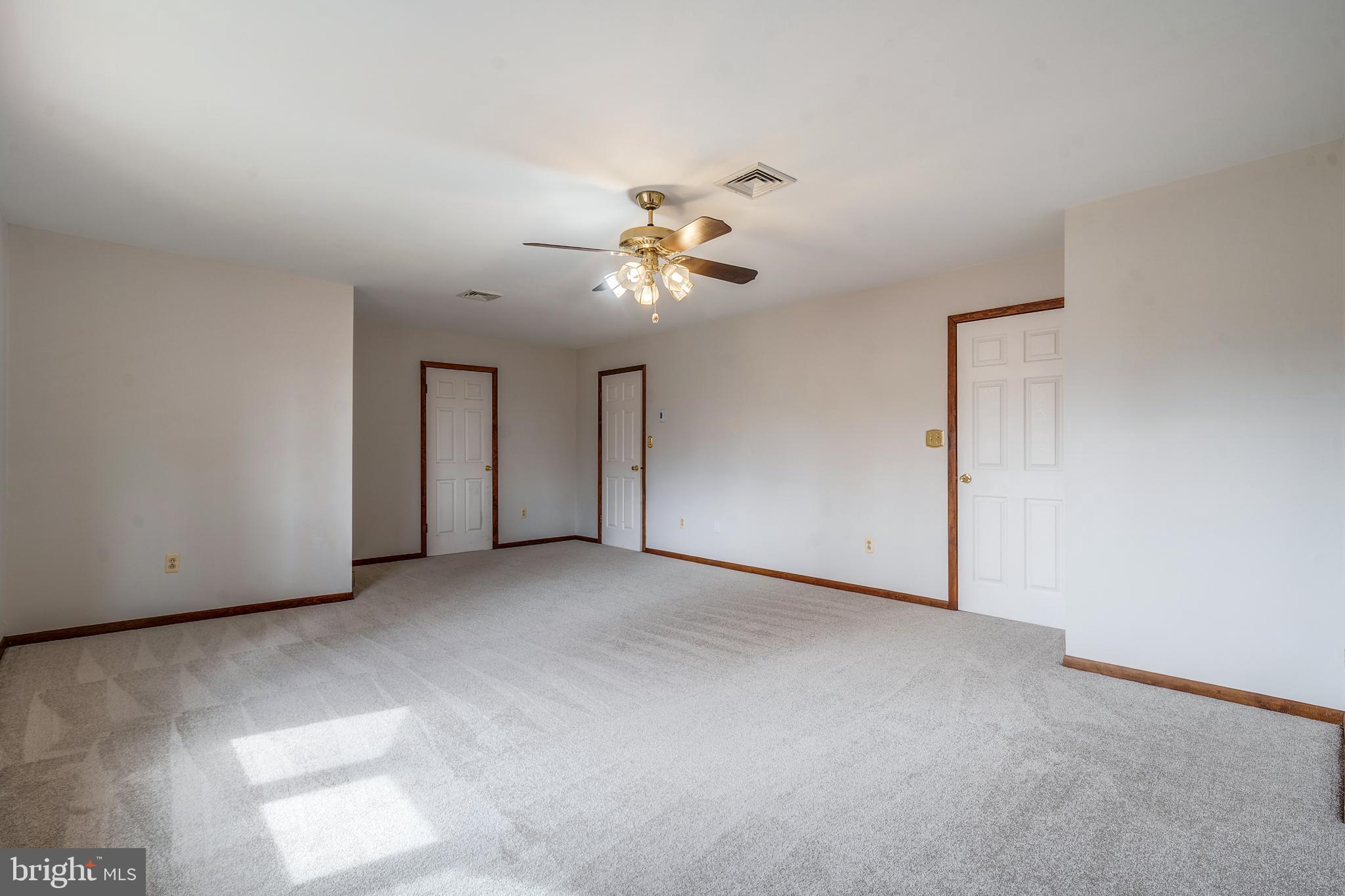 169 East Mountain Road Hillsborough, NJ 08844 - Photo 25 of 29 a view of a room with a ceiling fan and a chandelier fan