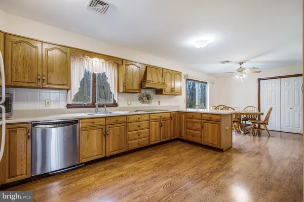 a large kitchen with a lot of counter space and a sink