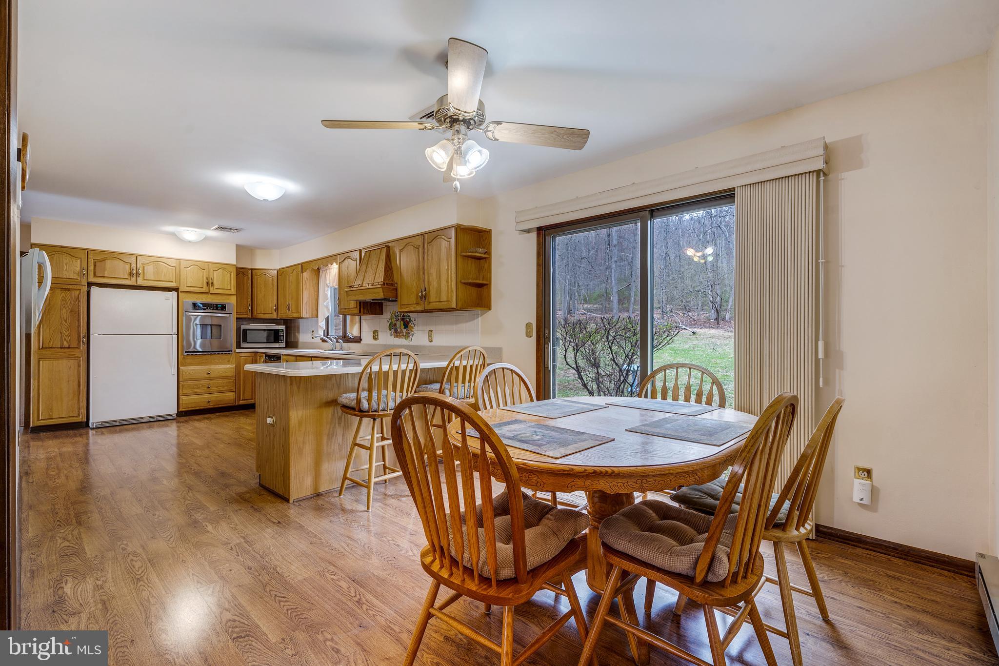169 East Mountain Road Hillsborough, NJ 08844 - Photo 8 of 29 a view of a dining room with furniture window and wooden floor