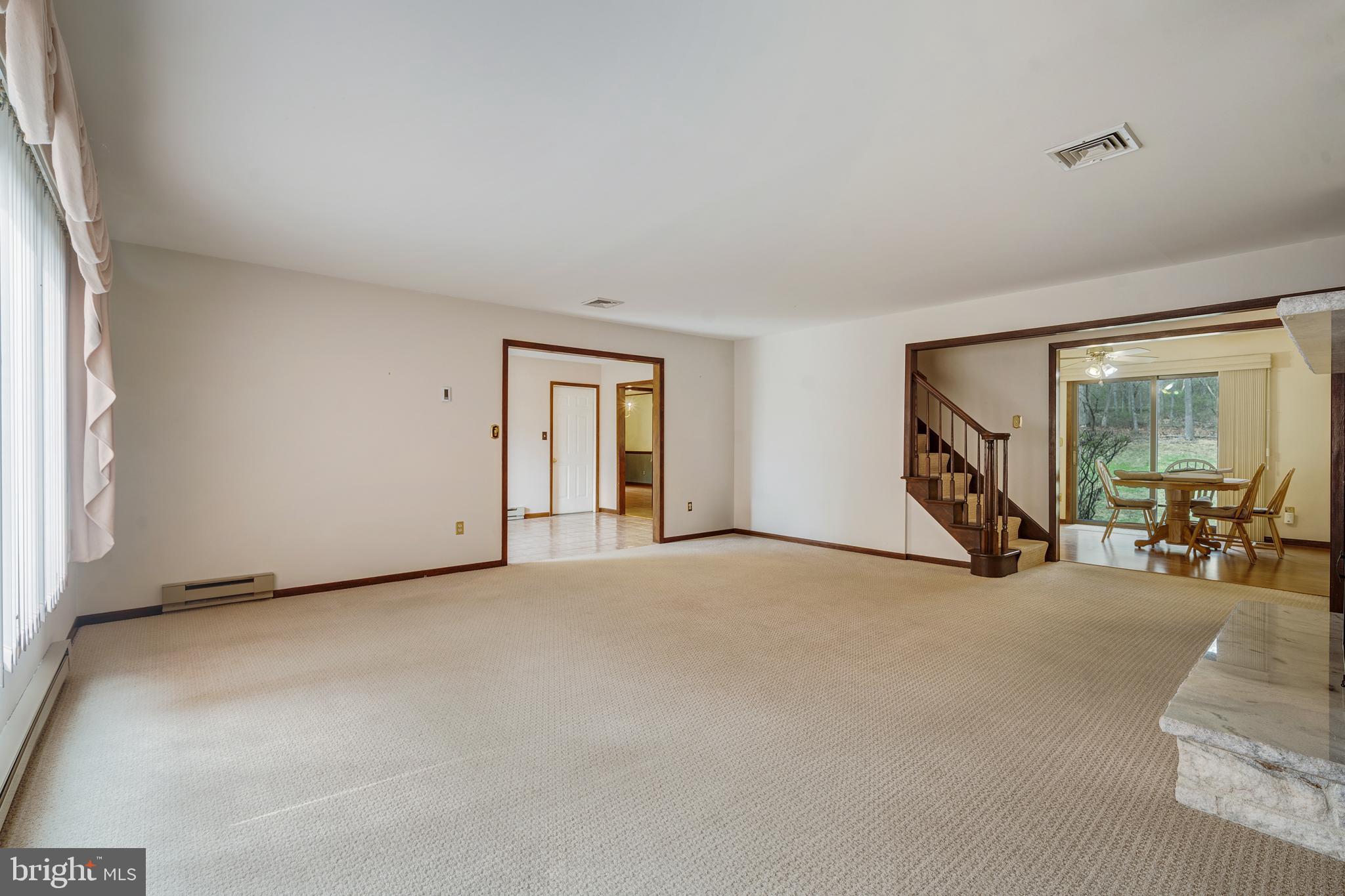 169 East Mountain Road Hillsborough, NJ 08844 - Photo 10 of 29 a view of a livingroom with glass door and furniture