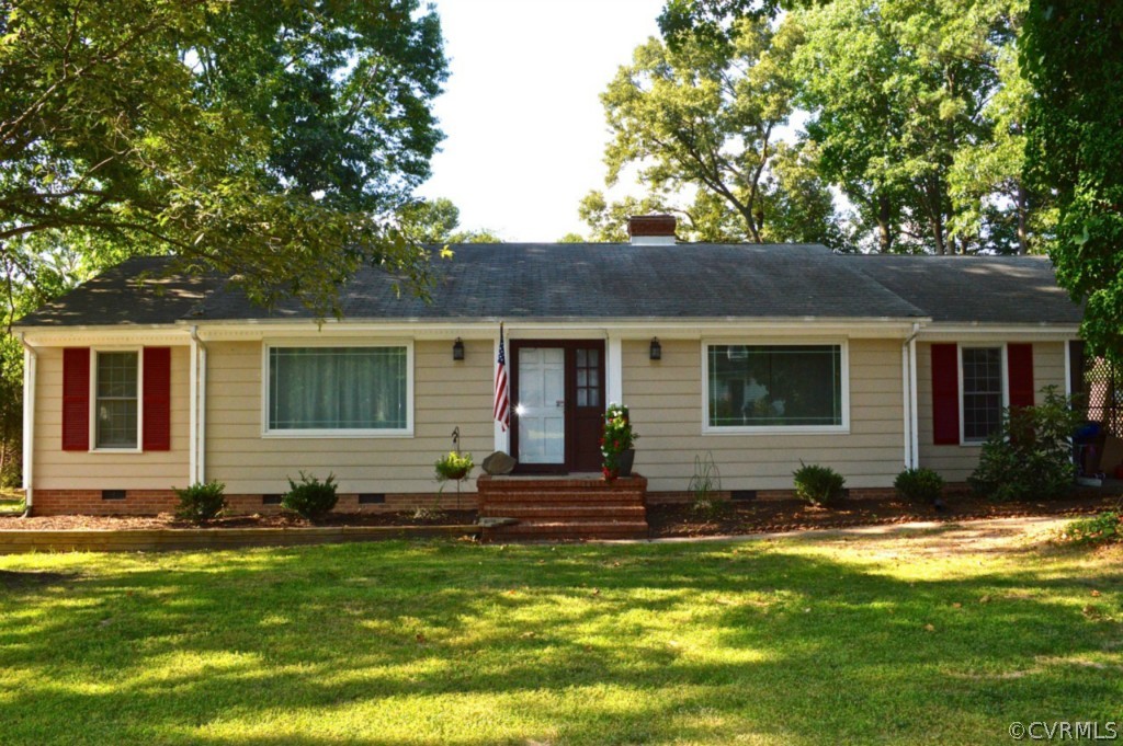 3650 Hemlock Road Chester, VA 23831 - Photo 1 of 12 a front view of house with yard outdoor seating and green space
