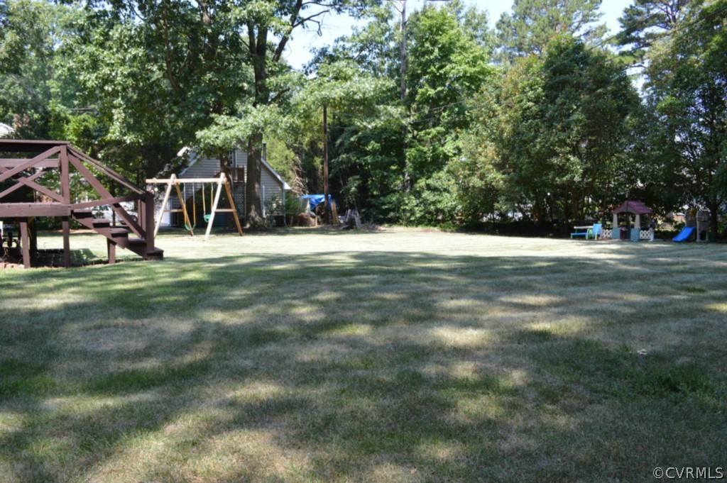 3650 Hemlock Road Chester, VA 23831 - Photo 11 of 12 a view of a house with a yard