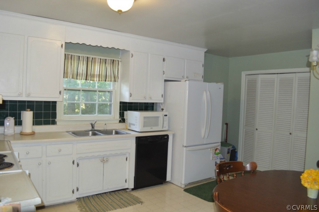 3650 Hemlock Road Chester, VA 23831 - Photo 5 of 12 a kitchen with a sink a stove a refrigerator and a window
