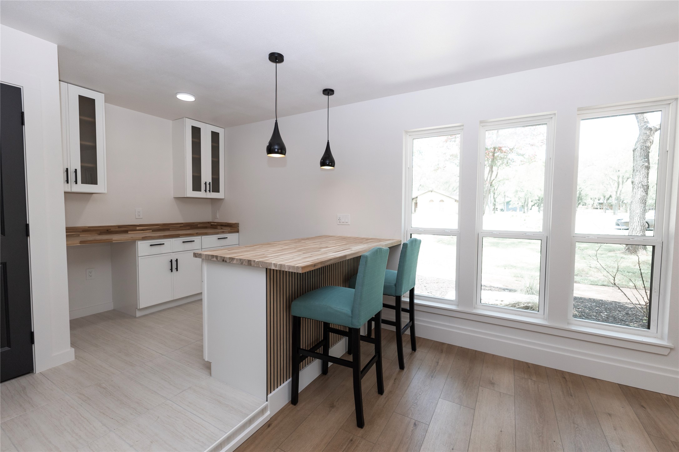 205 Bello Circle Georgetown, TX 78628 - Photo 15 of 36 A well-lit area features modern pendant lighting and rich wood countertops.