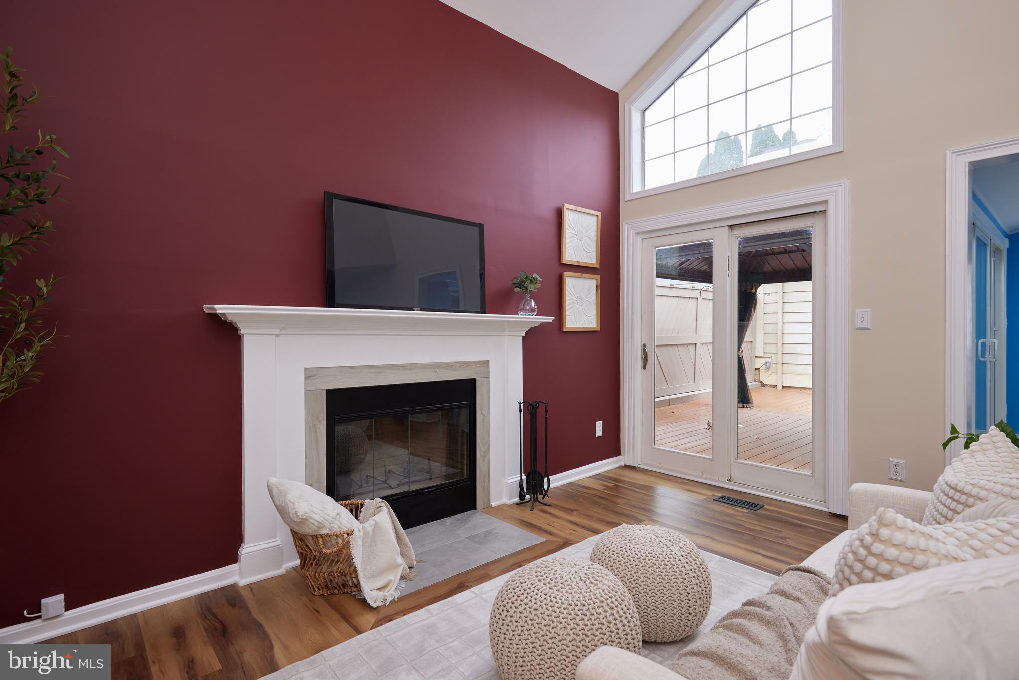 20100 Loading Rock Place Gaithersburg, MD 20886 - Photo 16 of 44 a bedroom with a bed and a fireplace