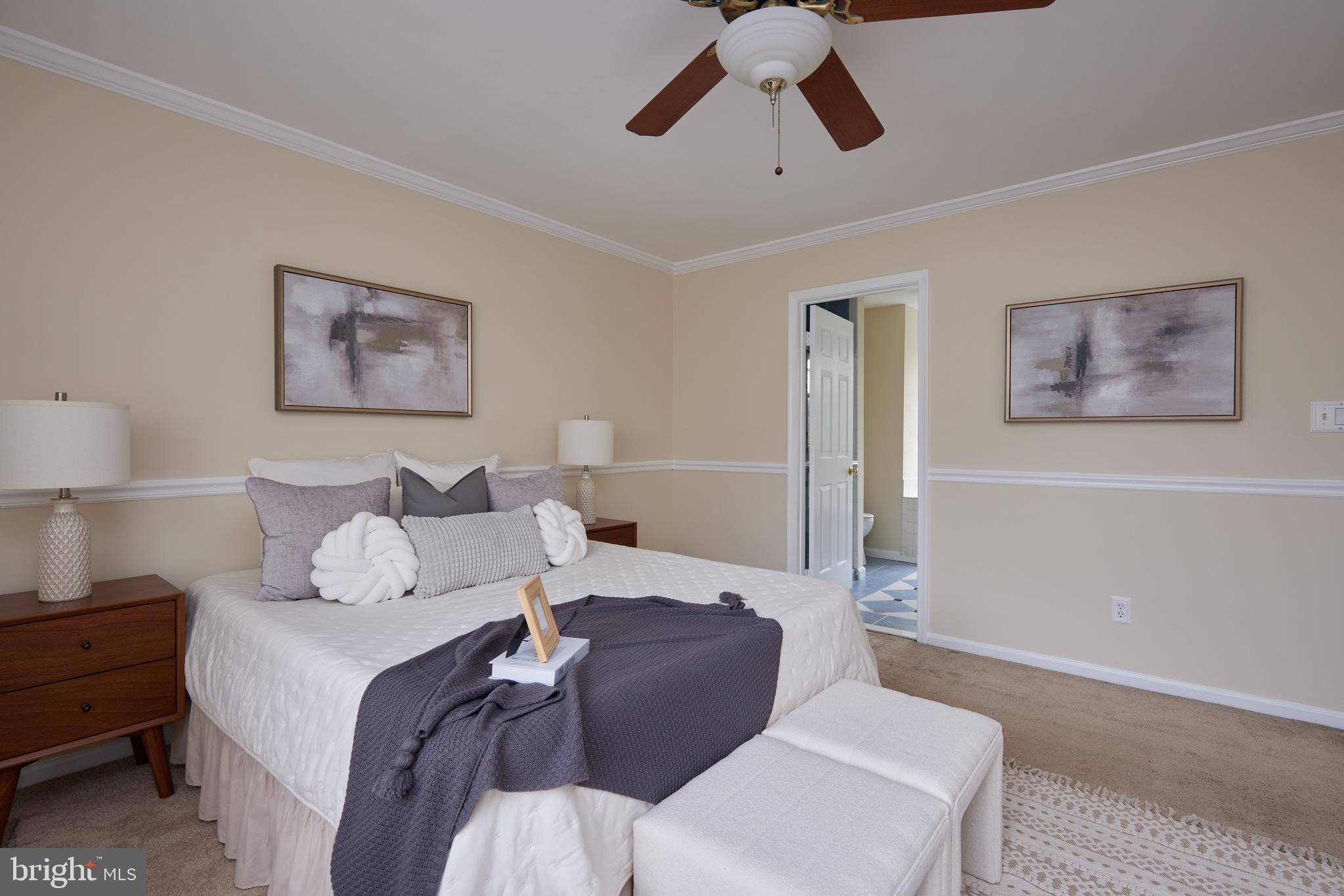 20100 Loading Rock Place Gaithersburg, MD 20886 - Photo 23 of 44 a bedroom with a bed and wooden floor