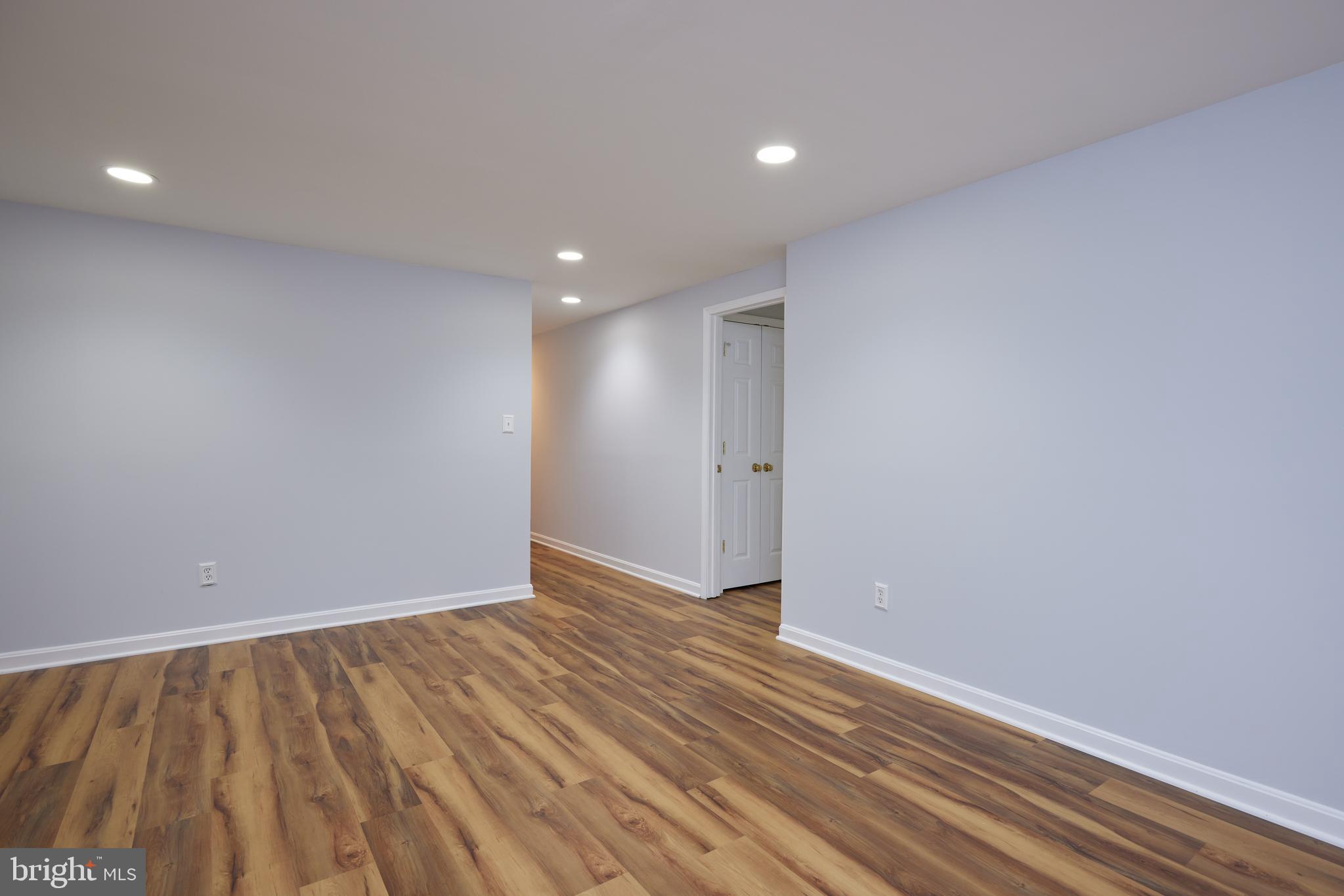20100 Loading Rock Place Gaithersburg, MD 20886 - Photo 34 of 44 a view of an empty room with wooden floor