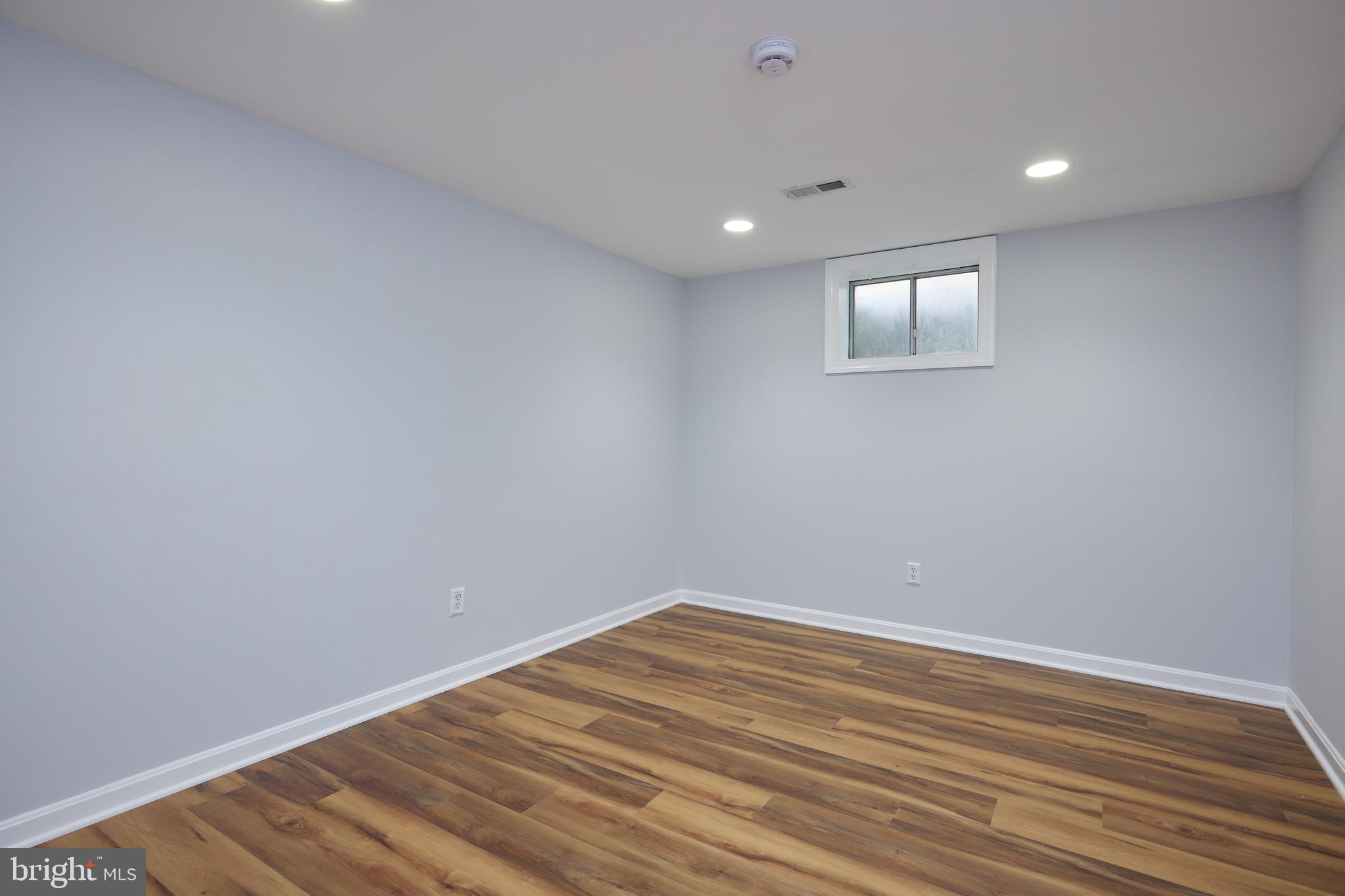 20100 Loading Rock Place Gaithersburg, MD 20886 - Photo 35 of 44 a view of a room with wooden floor and fan