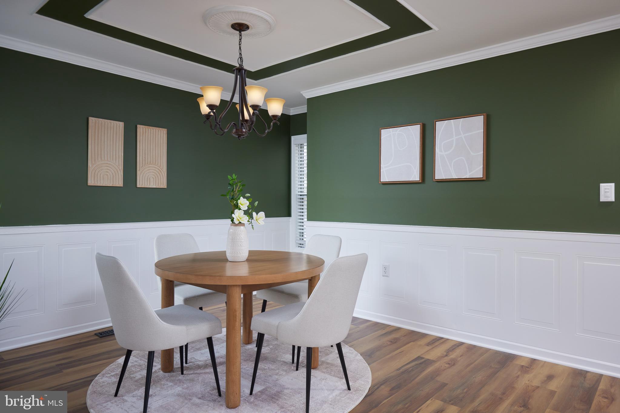 20100 Loading Rock Place Gaithersburg, MD 20886 - Photo 5 of 44 a view of a dining room with furniture and wooden floor