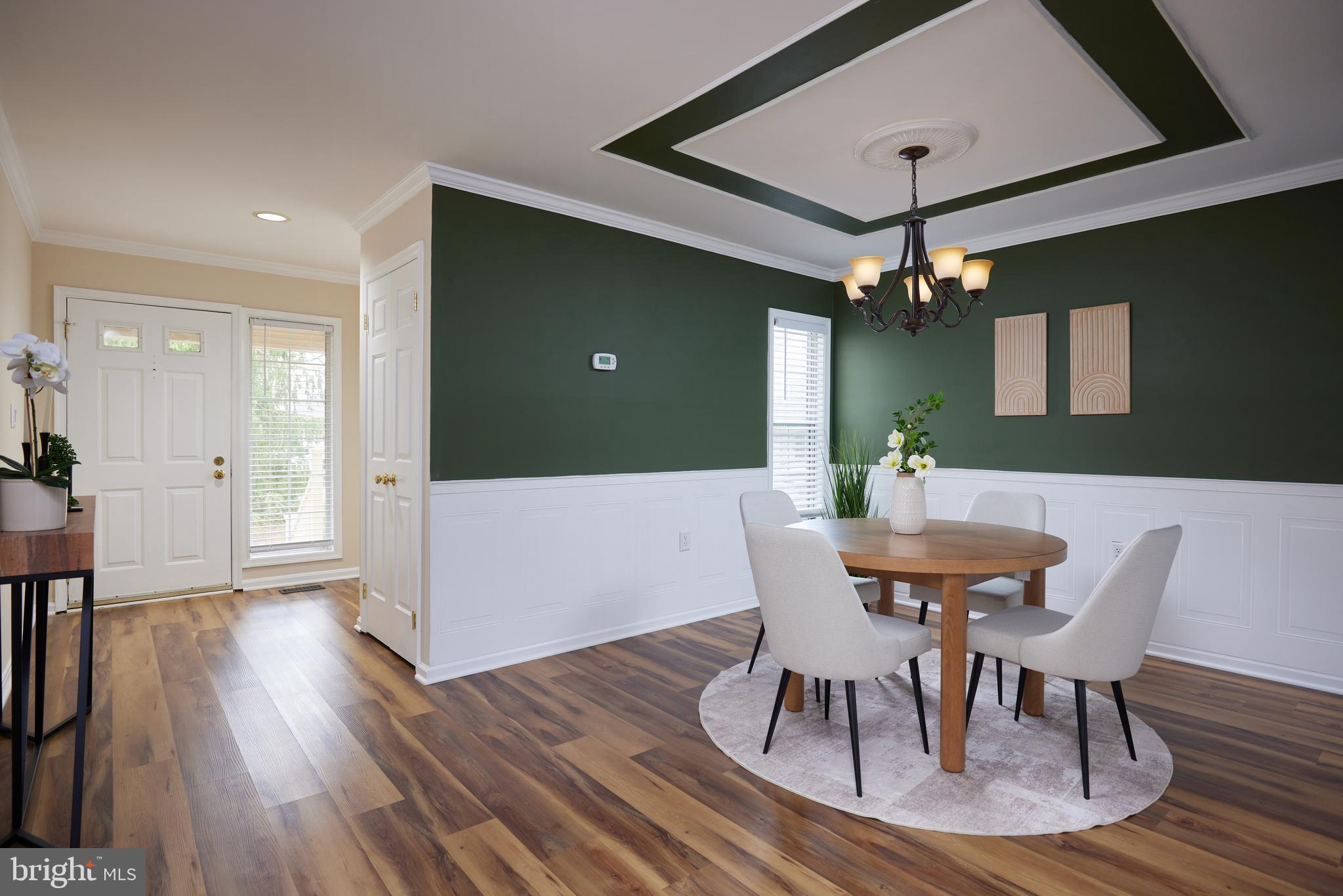 20100 Loading Rock Place Gaithersburg, MD 20886 - Photo 6 of 44 a view of a dining room with furniture and wooden floor