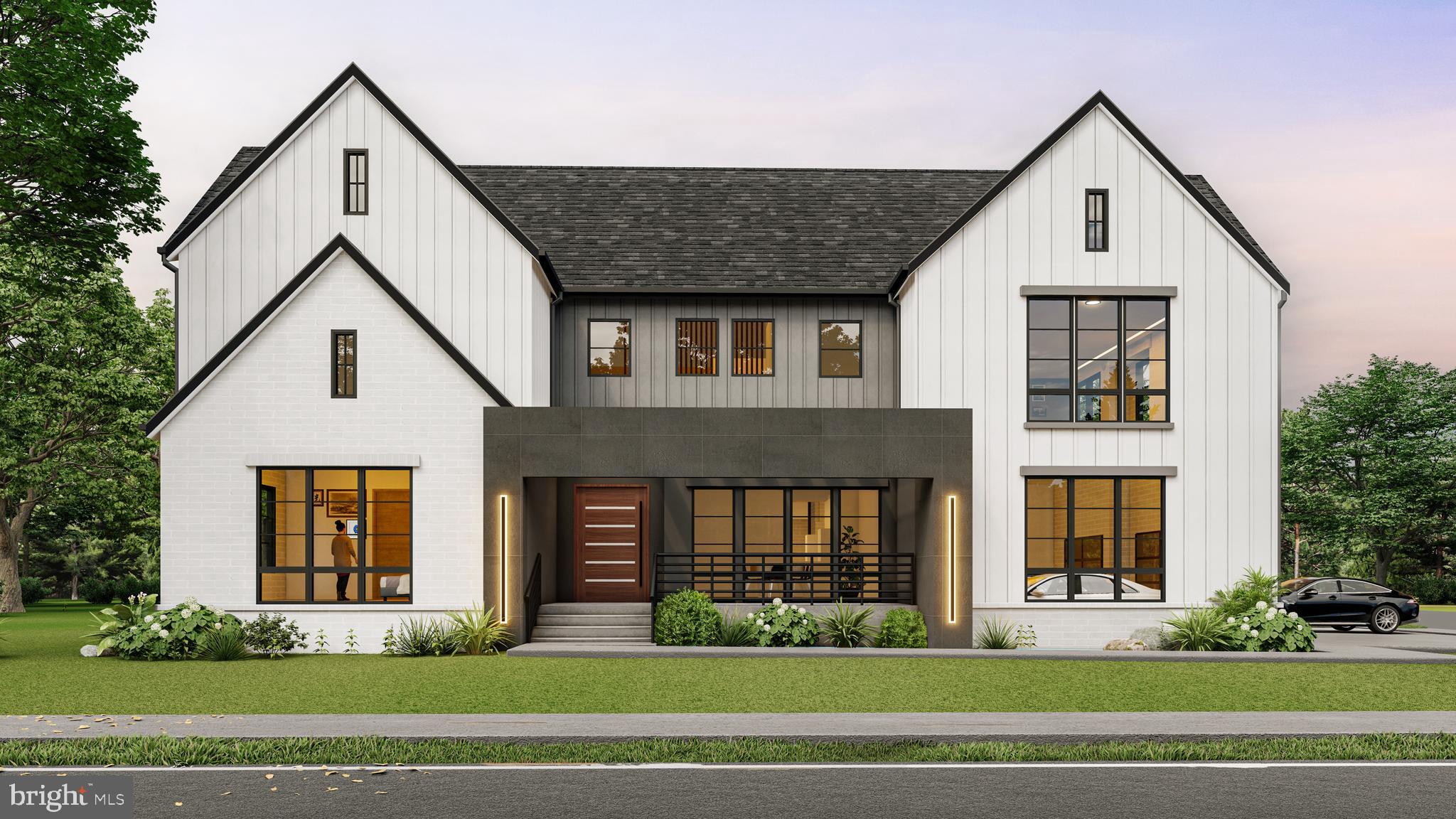 a front view of a house with a yard and potted plants