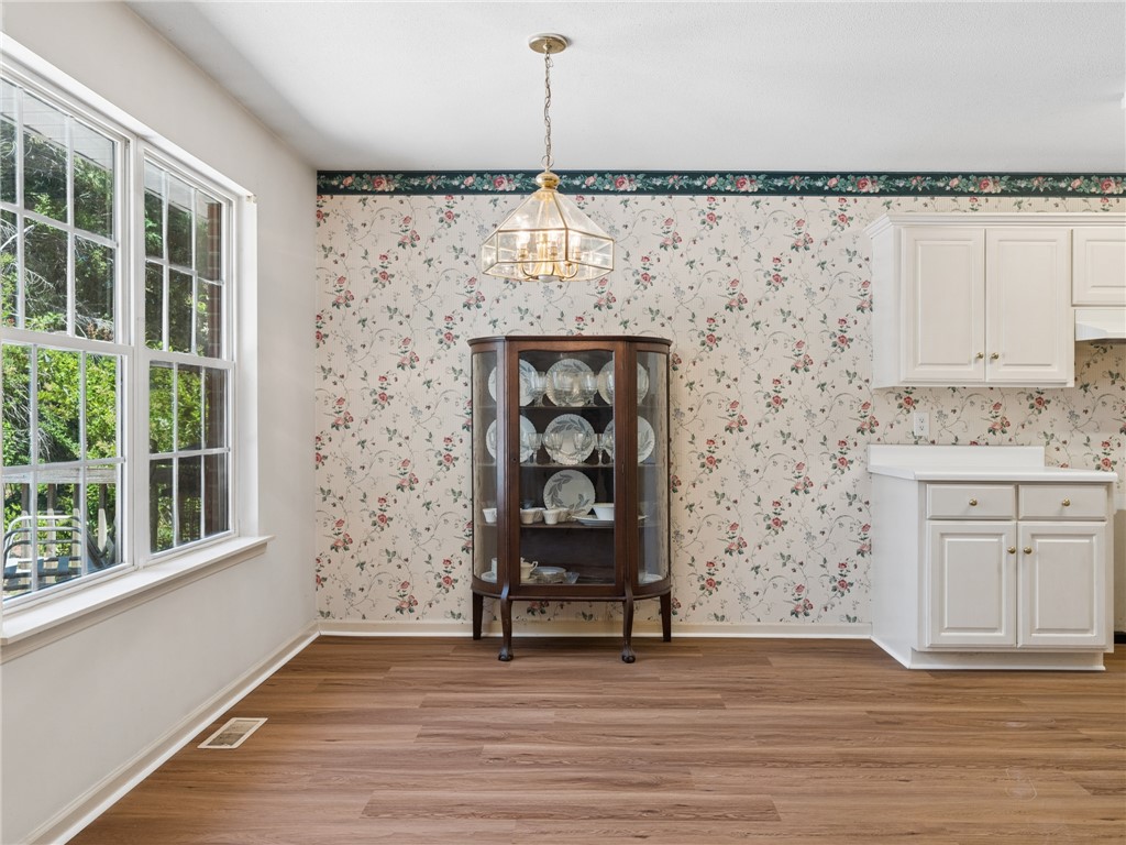 101 Woodbridge Circle Anderson, SC 29621 - Photo 6 of 21 This bright space features ample natural light and durable flooring, ideal for everyday living.