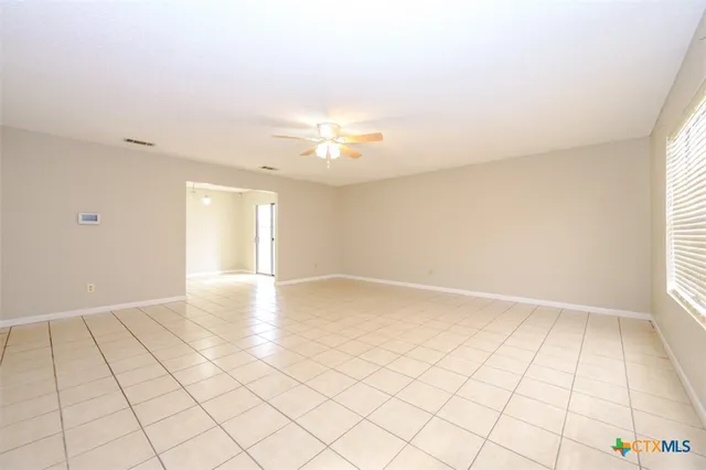 a view of an empty room and window