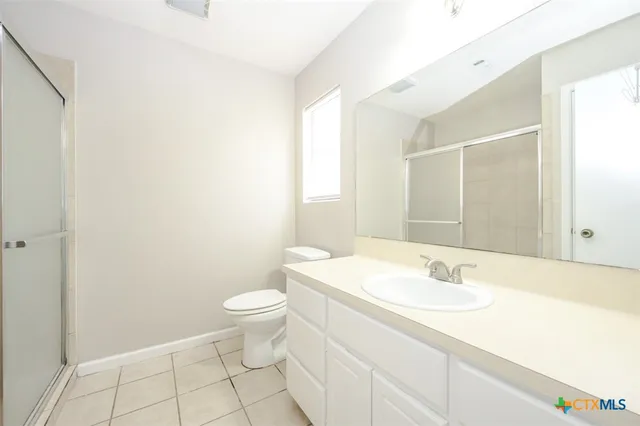 a bathroom with a sink toilet and vanity