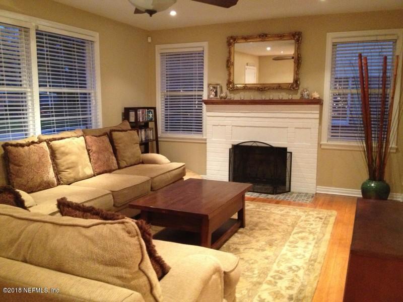 1462 Cheshire Road Jacksonville, FL 32207 - Photo 3 of 12 a living room with furniture and a fireplace