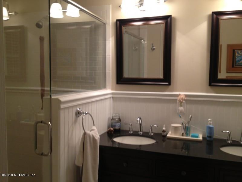 1462 Cheshire Road Jacksonville, FL 32207 - Photo 8 of 12 a bathroom with a sink vanity and mirror