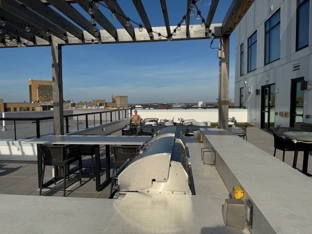 191 Washington Street, Unit 507 Boston, MA 02135 - Photo 21 of 23 a view of a swimming pool with seating area