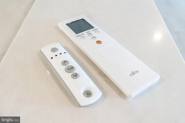 a bathroom with a double vanity sink mirror and shower