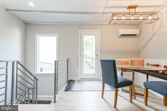 a white toilet sitting next to a white walls