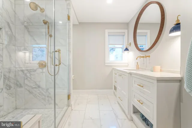 a view of living room with furniture and wooden floor