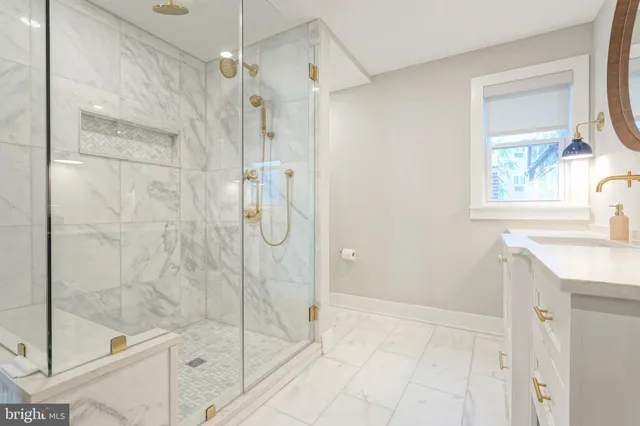 a bathroom with a sink a mirror and vanity