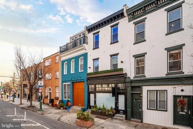 a kitchen that has a lot of cabinets in it and appliances