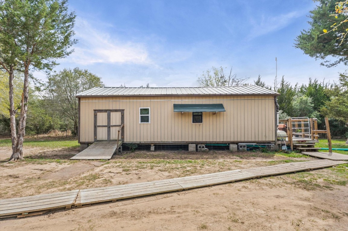 1221 Abel Road New Ulm, TX 78950 - Photo 4 of 15 a view of a house with a yard