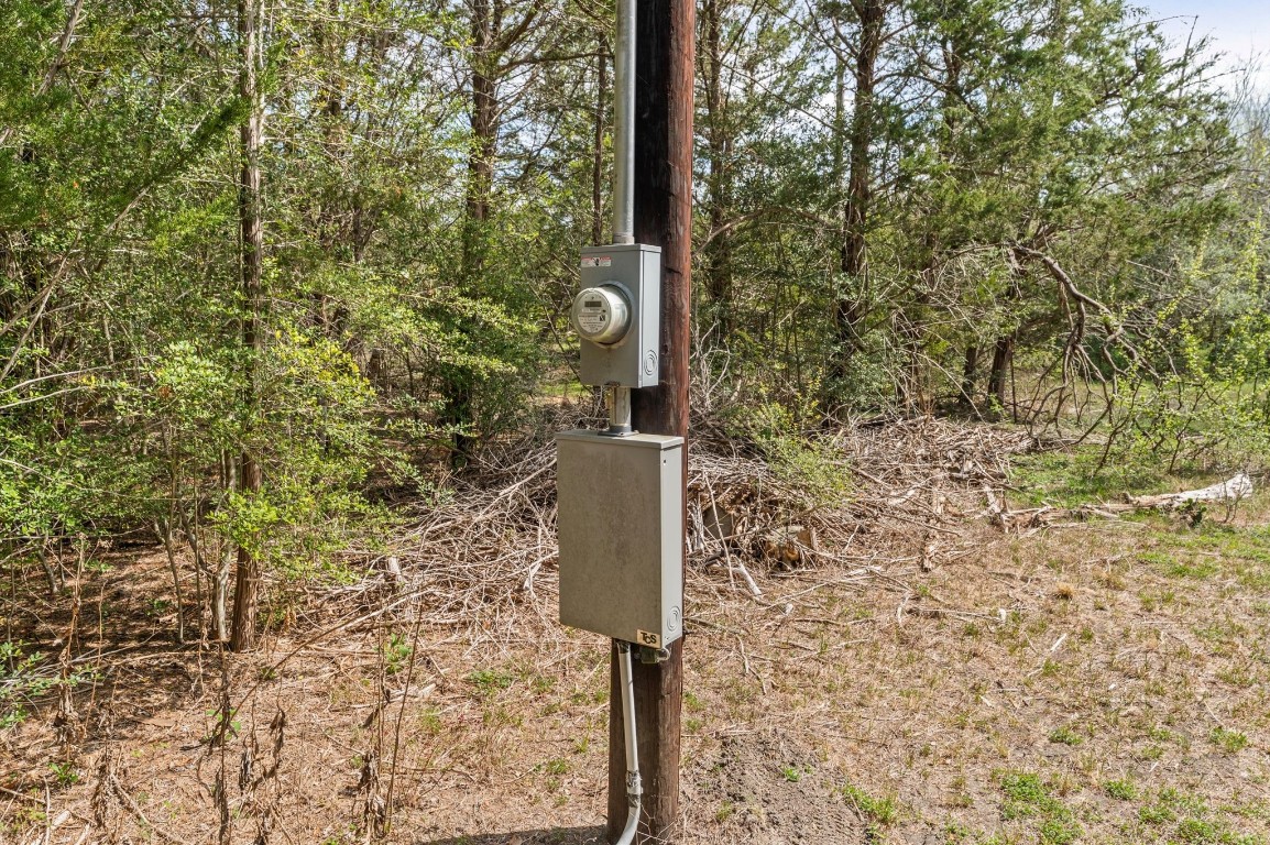 1221 Abel Road New Ulm, TX 78950 - Photo 8 of 15 a street sign on a wall next to a road