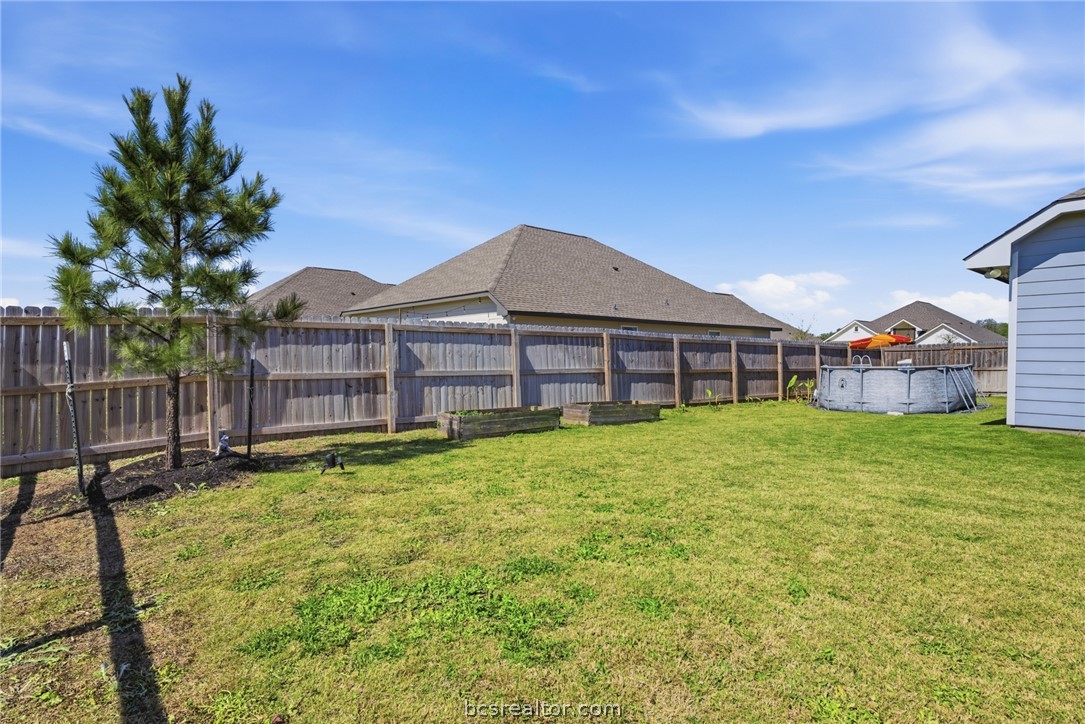 244 Brazos Bend Snook, TX 77879 - Photo 28 of 33 a front view of a house with a yard