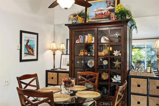 a view of a dining room with furniture and window