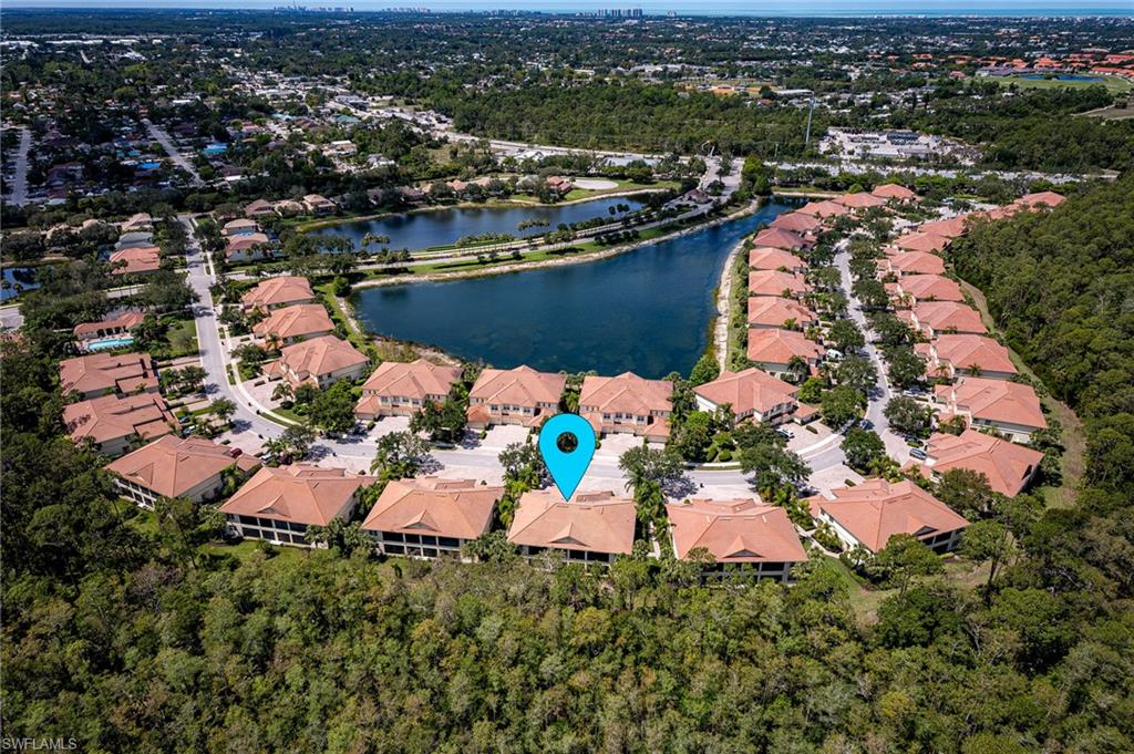26479 Lucky Stone Road, Unit 202 Bonita Springs, FL 34135 - Photo 1 of 38 an aerial view of a house with a lake view