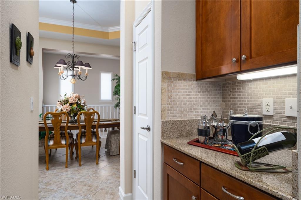 26479 Lucky Stone Road, Unit 202 Bonita Springs, FL 34135 - Photo 14 of 38 a kitchen with a sink and cabinets