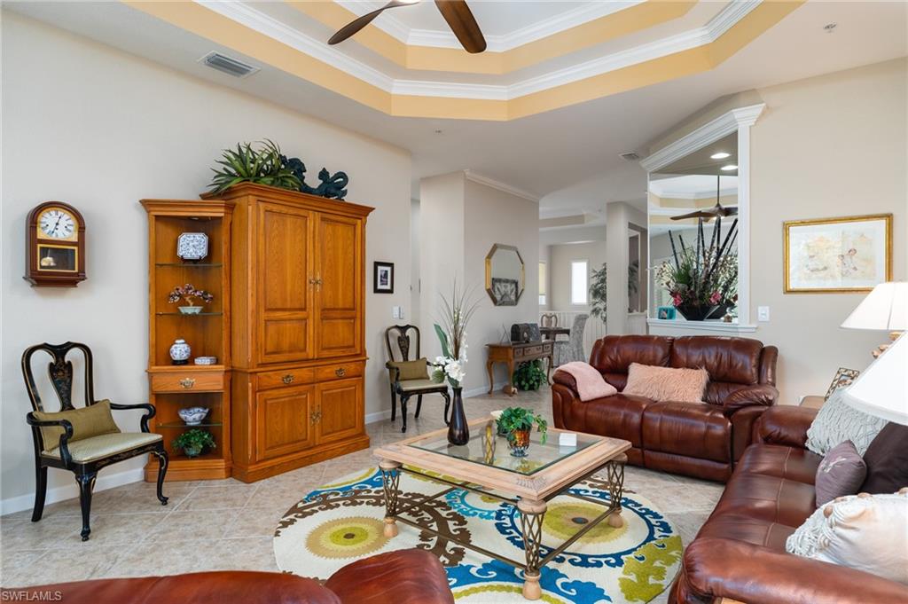 26479 Lucky Stone Road, Unit 202 Bonita Springs, FL 34135 - Photo 19 of 38 a living room with furniture and a window
