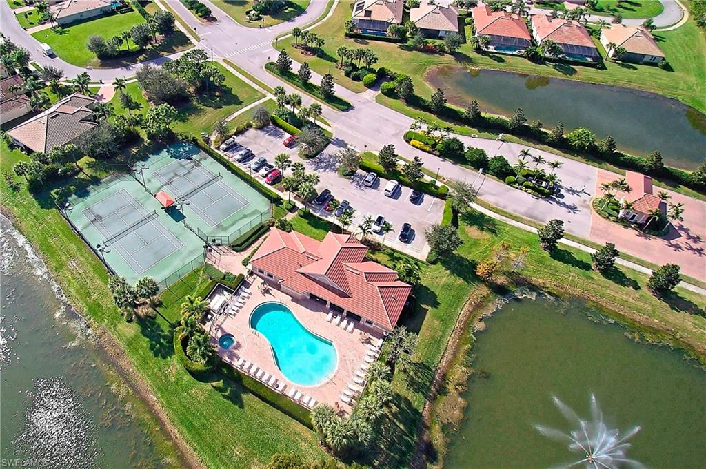 26479 Lucky Stone Road, Unit 202 Bonita Springs, FL 34135 - Photo 32 of 38 an aerial view of a house with a lake view