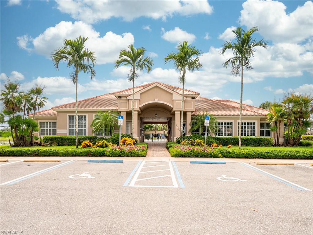 26479 Lucky Stone Road, Unit 202 Bonita Springs, FL 34135 - Photo 33 of 38 a front view of house with yard and green space