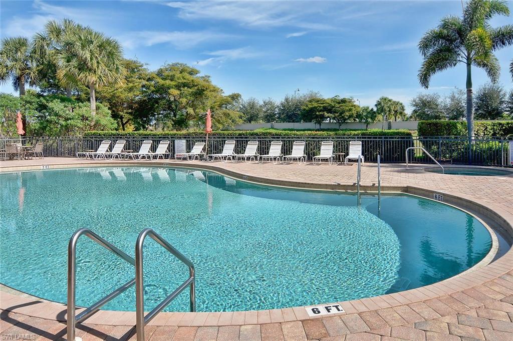 26479 Lucky Stone Road, Unit 202 Bonita Springs, FL 34135 - Photo 34 of 38 a view of a swimming pool with a garden