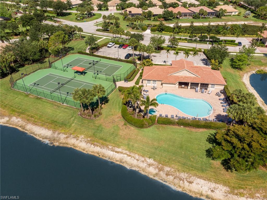 26479 Lucky Stone Road, Unit 202 Bonita Springs, FL 34135 - Photo 36 of 38 an aerial view of residential houses with outdoor space