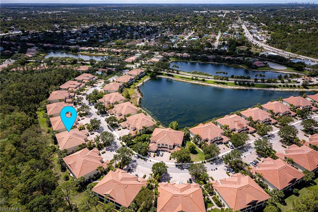26479 Lucky Stone Road, Unit 202 Bonita Springs, FL 34135 - Photo 4 of 38 an aerial view of residential houses with outdoor space