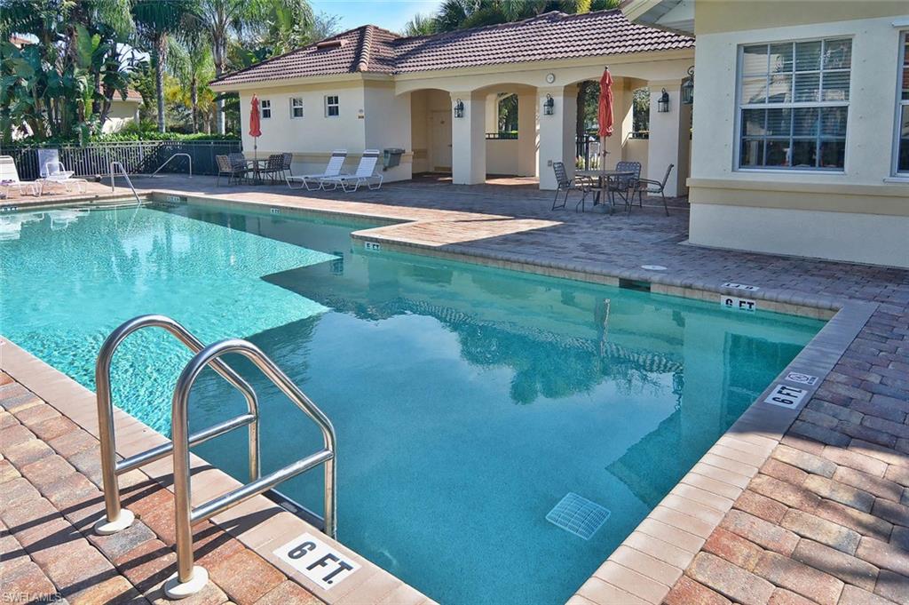 26479 Lucky Stone Road, Unit 202 Bonita Springs, FL 34135 - Photo 6 of 38 a front view of a house with swimming pool
