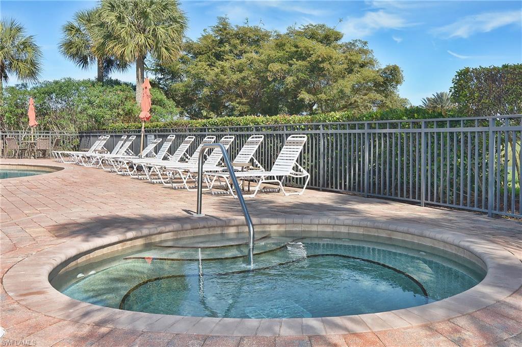 26479 Lucky Stone Road, Unit 202 Bonita Springs, FL 34135 - Photo 7 of 38 a view of a swimming pool with a patio