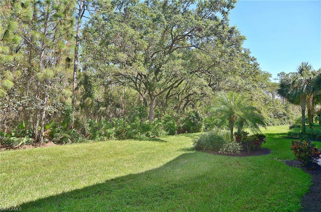 26479 Lucky Stone Road, Unit 202 Bonita Springs, FL 34135 - Photo 8 of 38 a view of a field with trees