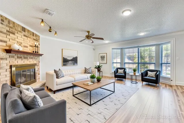 a living room with furniture and a fireplace