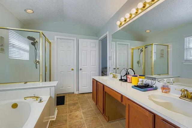 a bathroom with a sink double vanity and a mirror