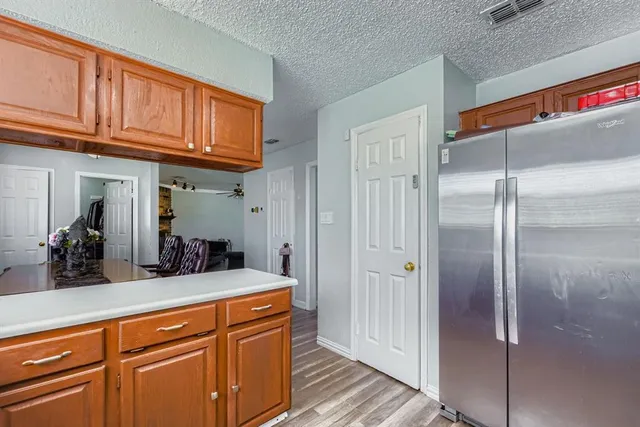 a view of a kitchen from the hallway