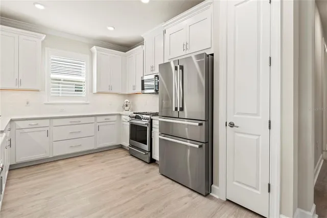 a front view of house and yard with green space