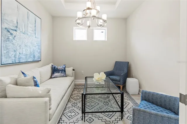 a view of swimming pool with outdoor seating and lake view