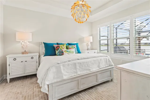 a view of a tennis ground with a table and chairs