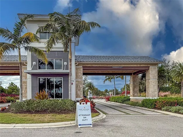a front view of a house with potted plants