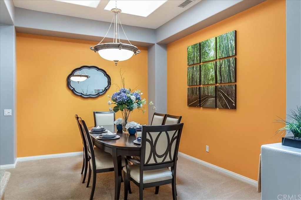 5 Champagne Circle Rancho Mirage, CA 92270 - Photo 13 of 41 a dining room with furniture and window