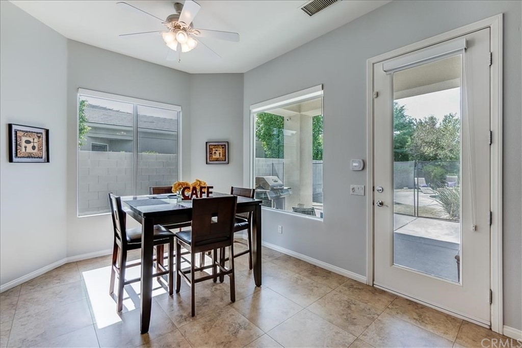 5 Champagne Circle Rancho Mirage, CA 92270 - Photo 17 of 41 a view of a dining room with furniture window and outside view
